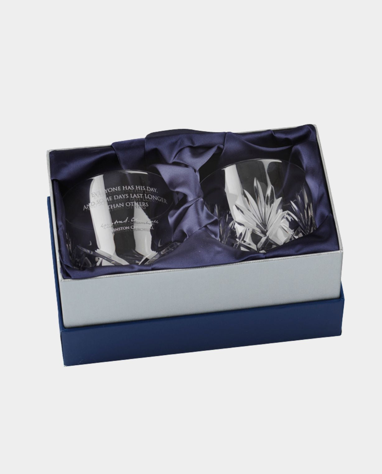 Two crystal glasses in a decorative box with a white background