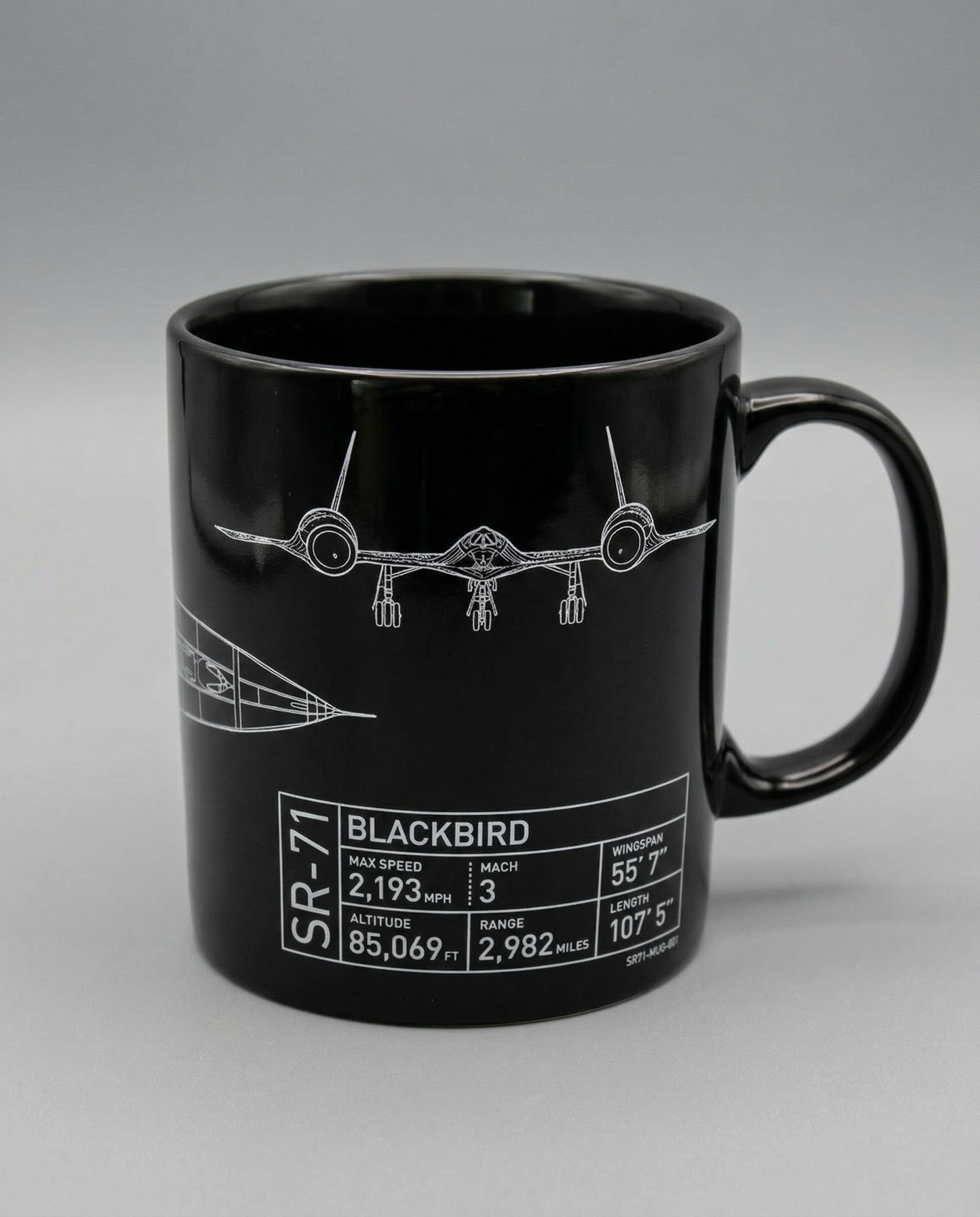 Black mug with SR-71 Blackbird design and specifications on a gray background