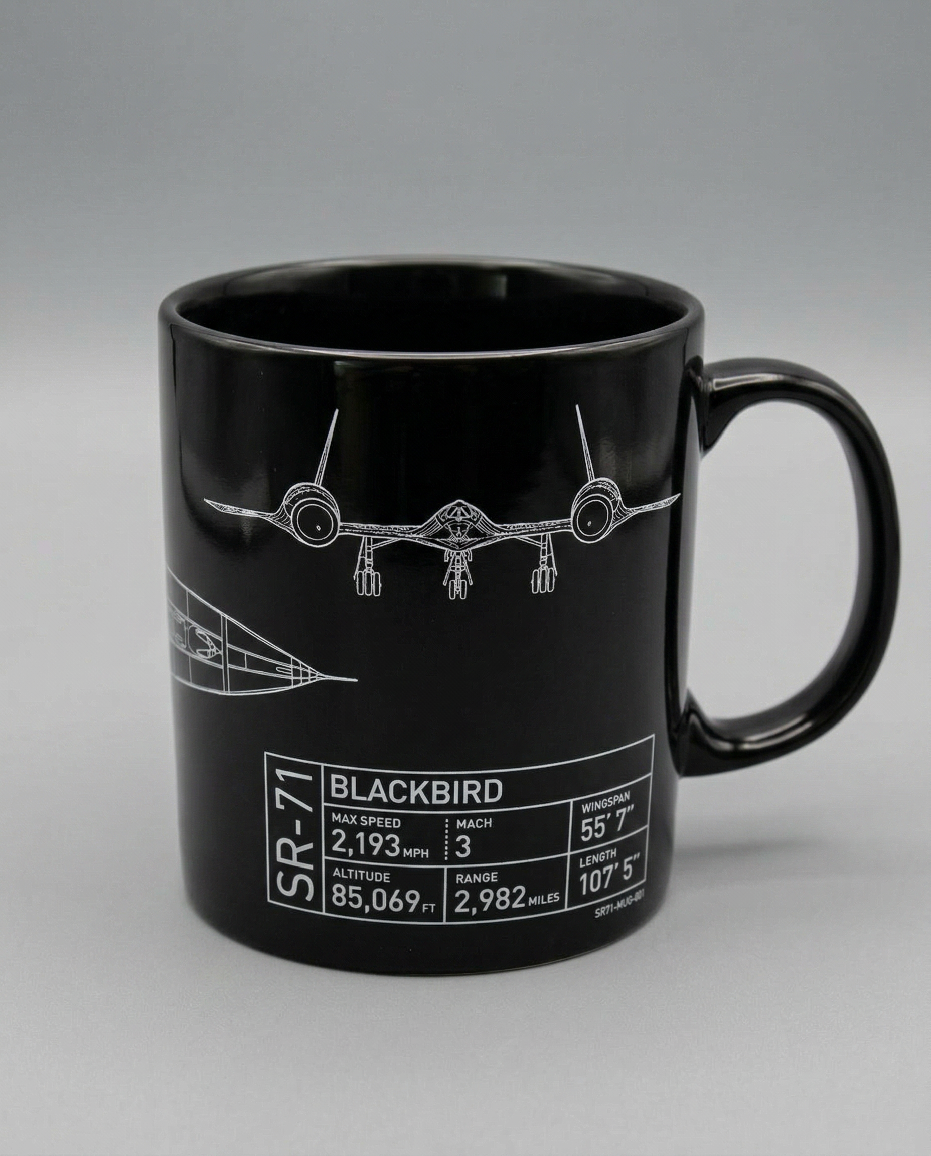Black mug with SR-71 Blackbird design and specifications on a gray background