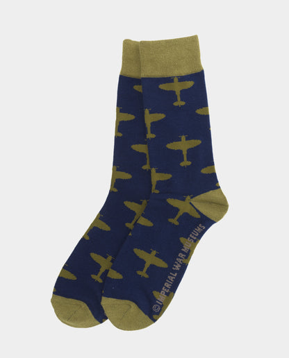 A pair of navy blue socks with a yellow Spitfire aircraft pattern and green detailing at the heel and toe.