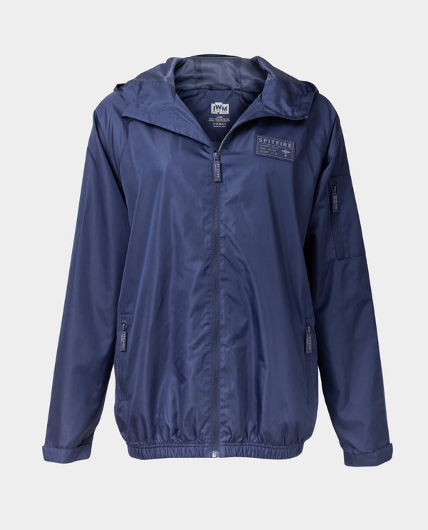 Navy blue jacket with a hood and multiple zipped pockets, featuring a rubberized zipper pull and a chest applique with the text 'Supermarine Spitfire'.