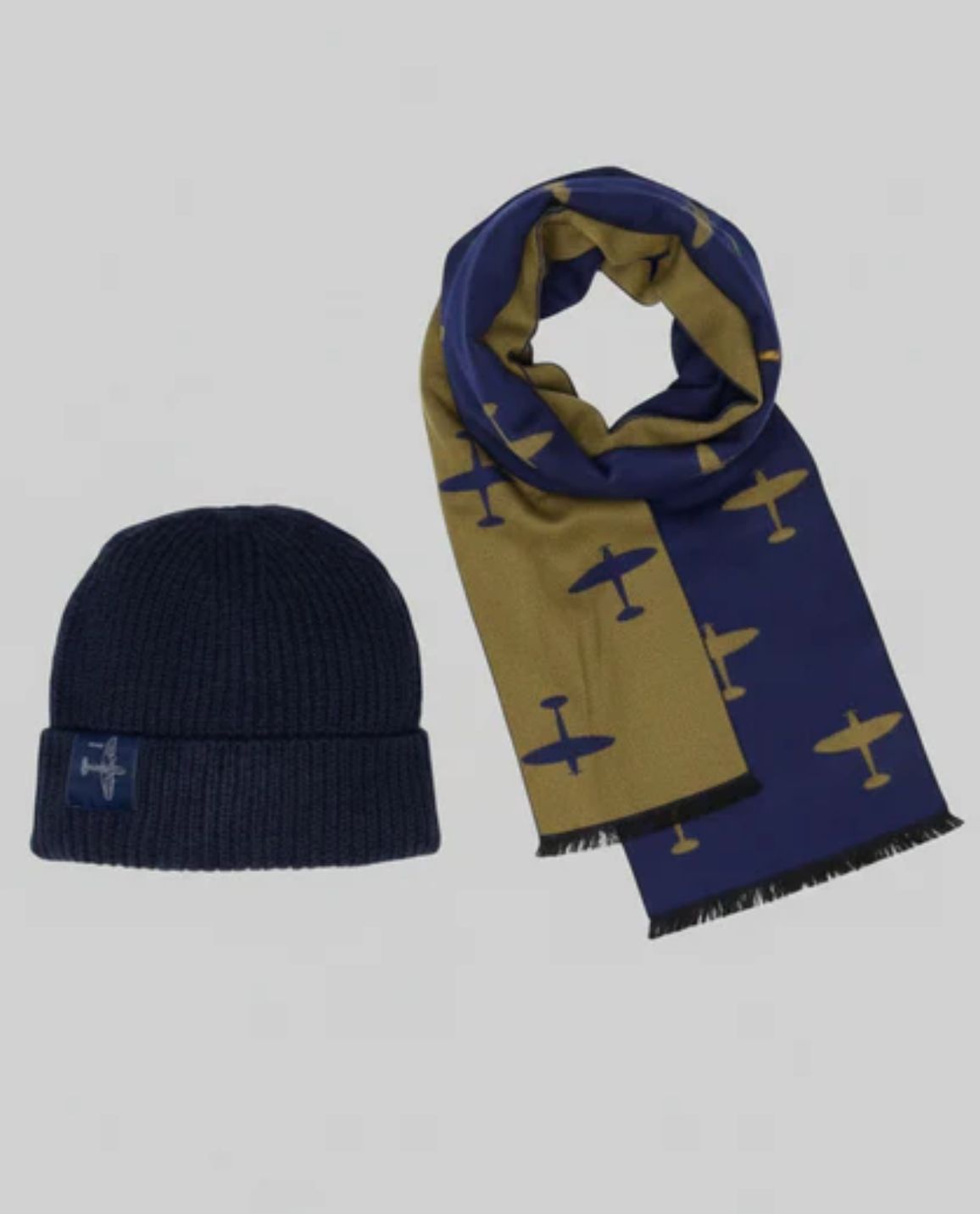 Navy blue Spitfire Beanie with embossed Spitfire Blueprint design, and a Blue and Yellow Spitfire scarf with Spitfire silhouette designs all over it.