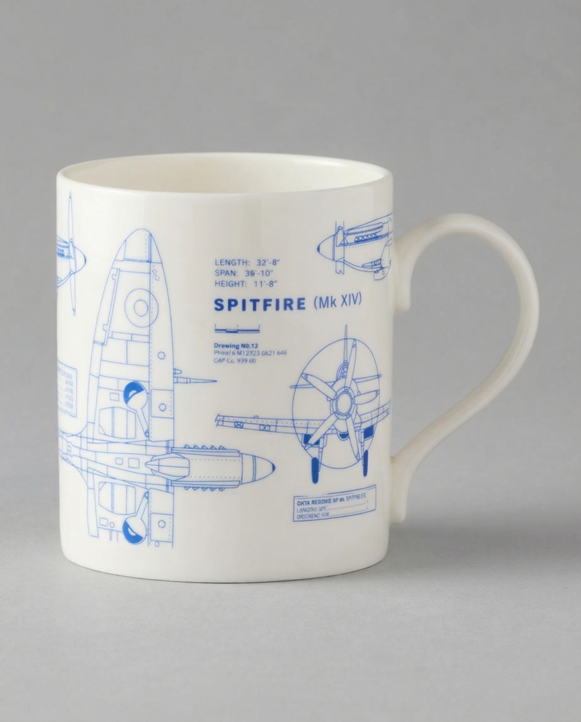 White mug with blue Spitfire Mk XIV blueprint design on a gray background