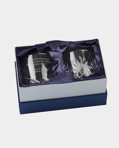 Two crystal glasses in a decorative box with a white background